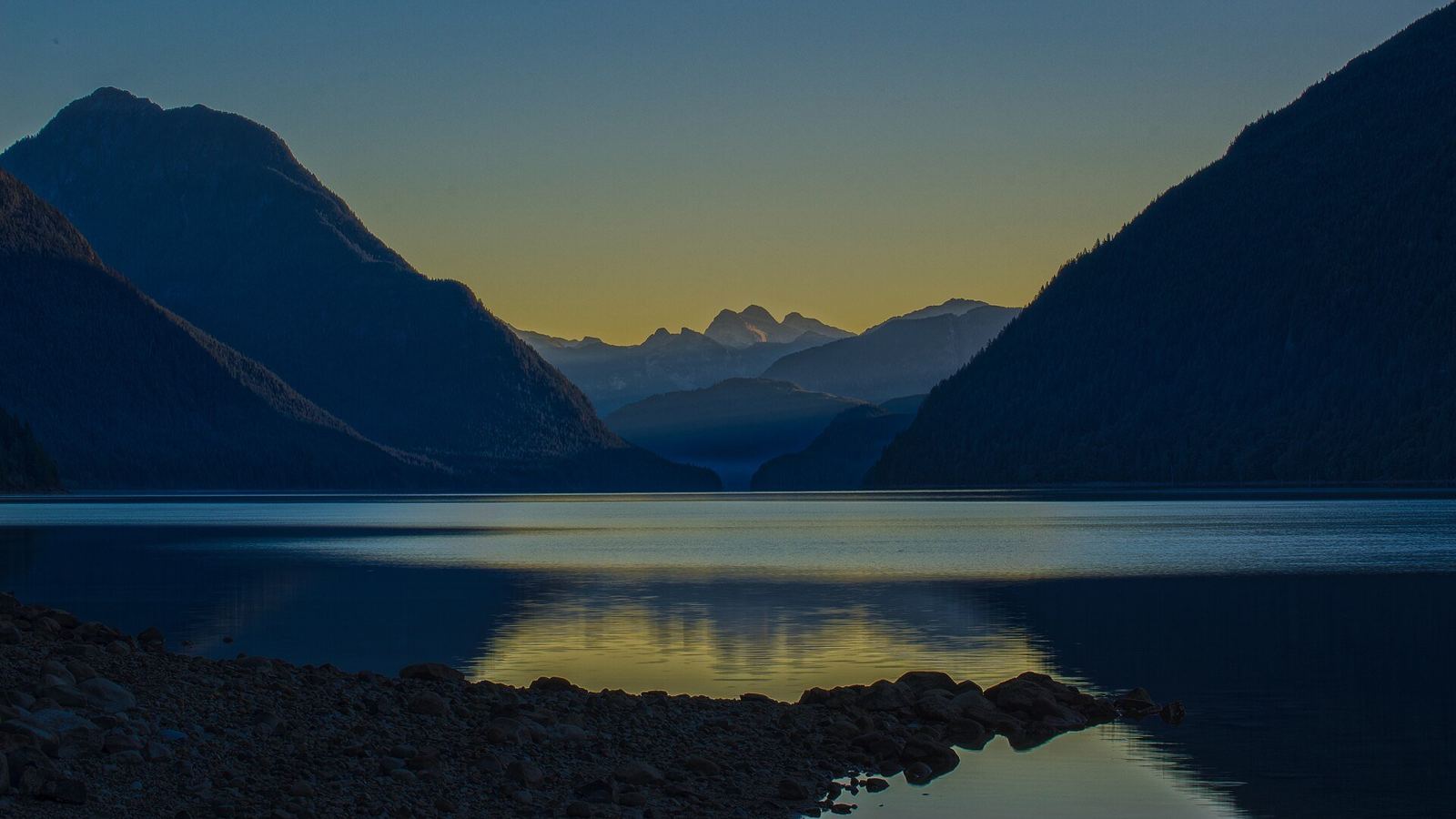 Sunrise over Alouette Lake in Maple Ridge with mountains reflected in the water