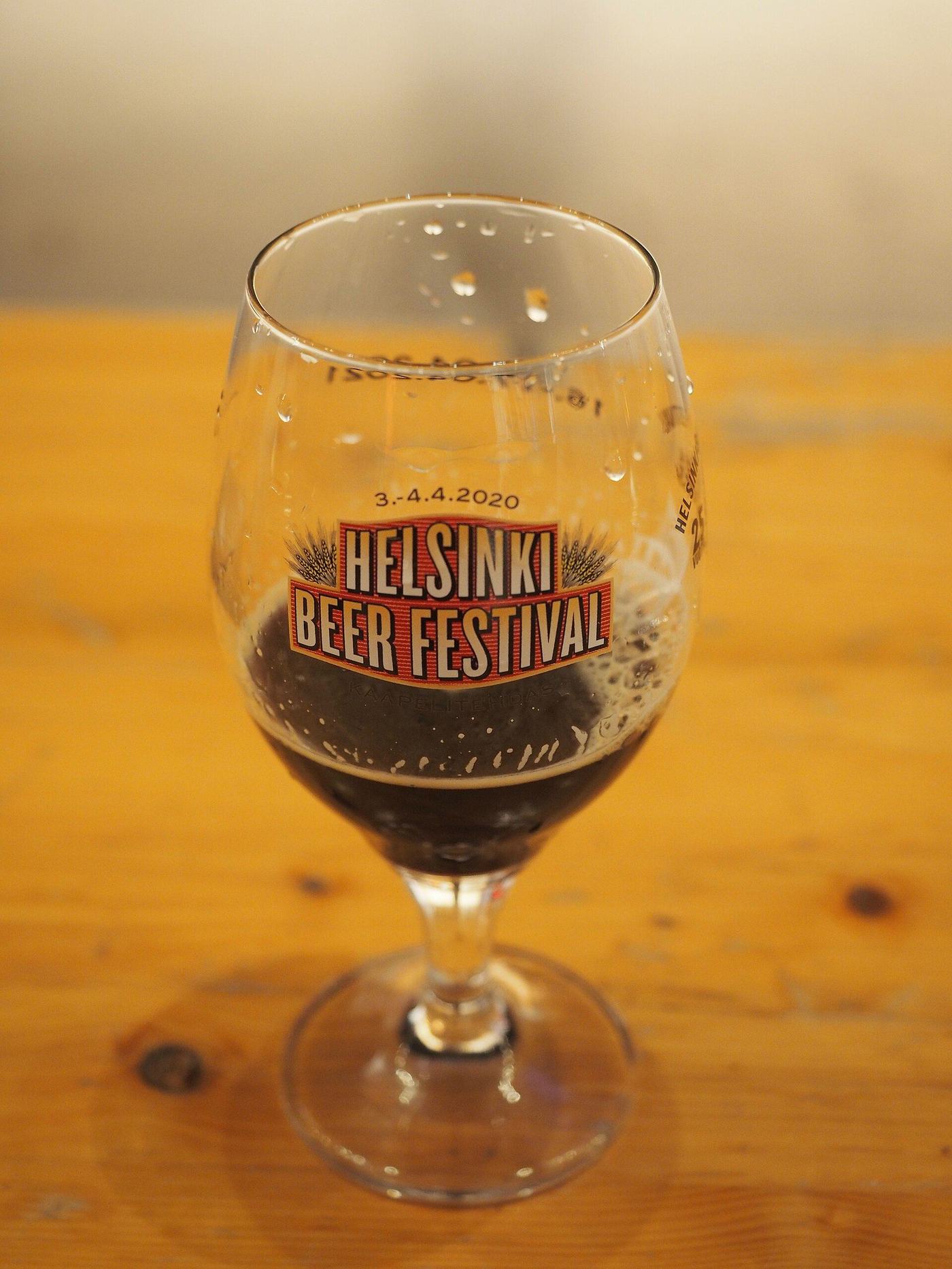 A small glass of craft beer at a beer festival
