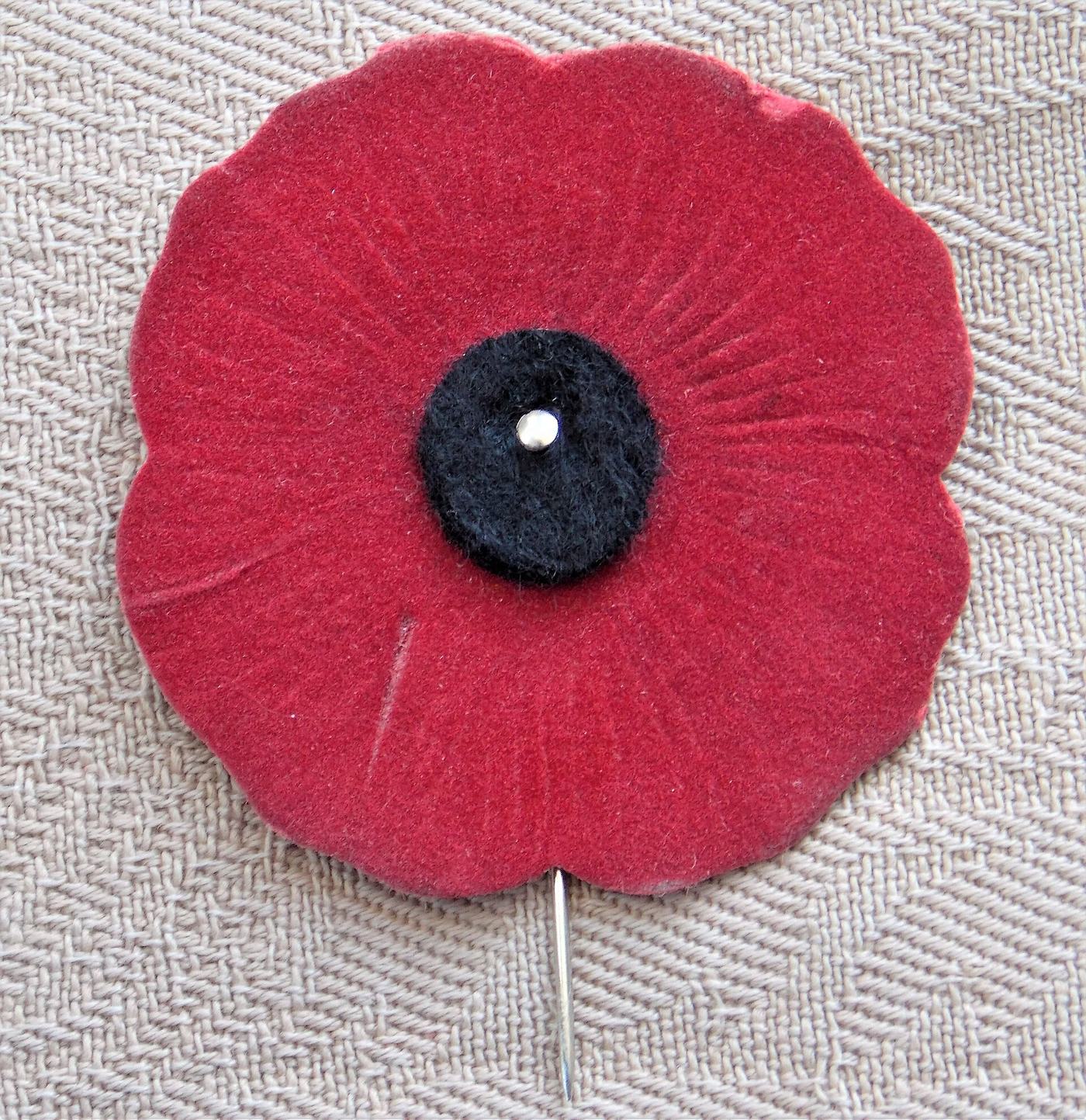 A vintage Canadian Vetcraft remembrance poppy pin