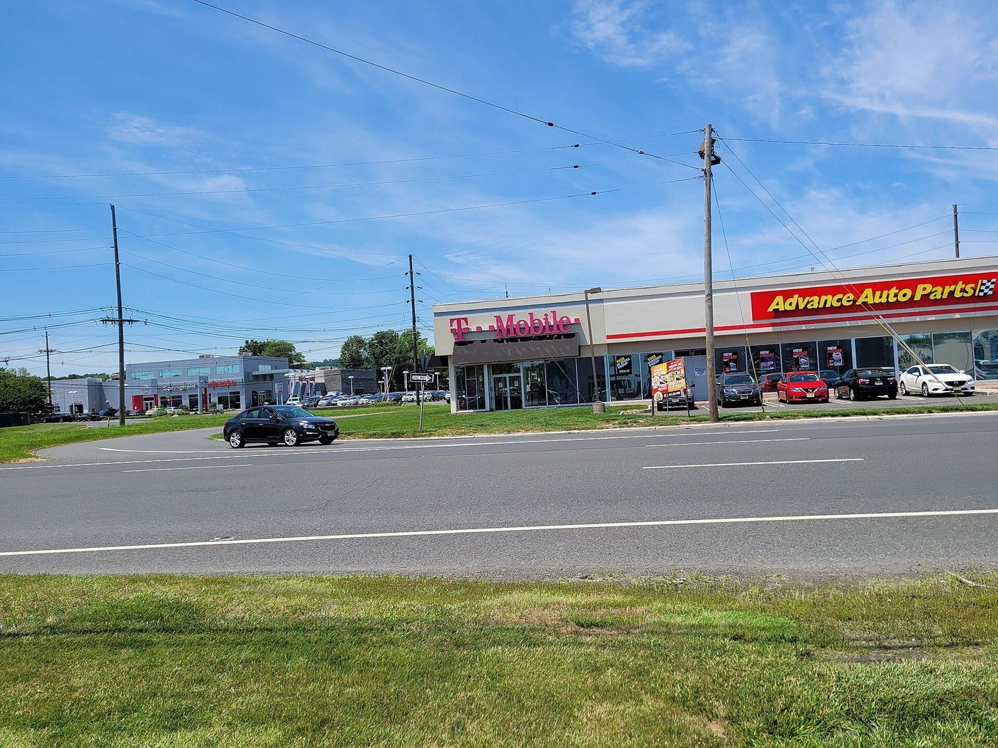 A Tesla service centre building with red Tesla signage